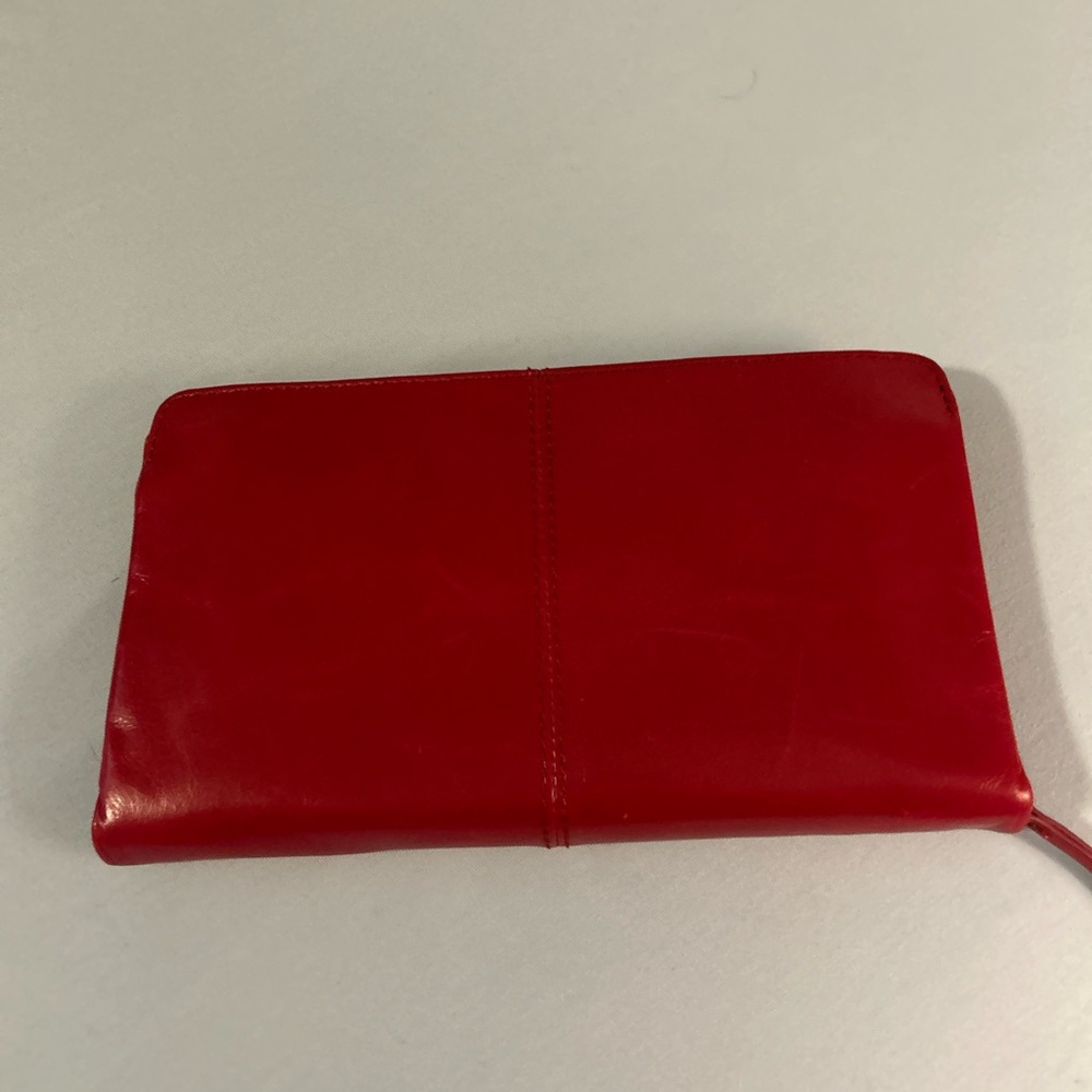 HOBO Evolve Wristlet in polished leather crimson